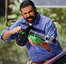 Billy Mays holding a car wash gun