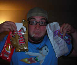 KC holding up 4 bags of candy