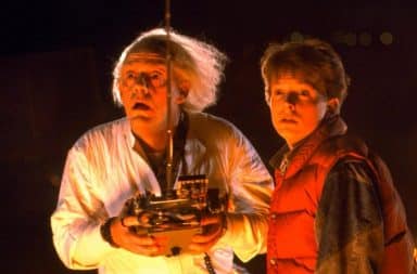 Doc Brown and Marty holding remote control in Back to the Future