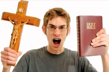 Man angry at God, holding a cross and a Bible