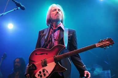 Tom Petty on stage with a guitar