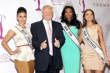 Donald Trump with three beauty pageant contestant women