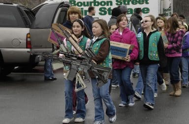 Girl Scouts selling cookies and guns