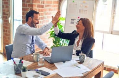 High five in a biz meeting