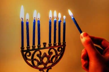 menorah lighting candles
