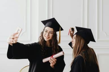 College graduates taking a selfie together