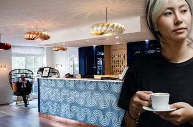 woman in a hotel lobby with a little coffee