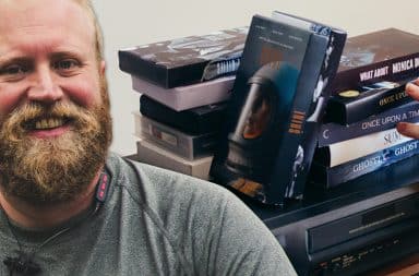 guy in front of a lot of tapes