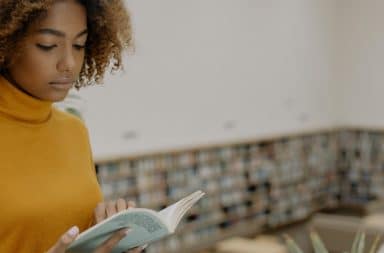 woman reading a book... in a library!?