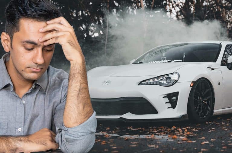 sad guy with the fancy car